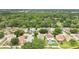Aerial view of a neighborhood with tree-lined streets and well-maintained homes at 7469 Hunters Greene Cir, Lakeland, FL 33810