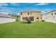 Large backyard featuring a trampoline, and a white fence for privacy at 7469 Hunters Greene Cir, Lakeland, FL 33810