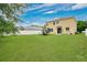 Extensive backyard showcasing a home bordered by a modern fence at 7469 Hunters Greene Cir, Lakeland, FL 33810