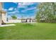 Spacious backyard showcasing a trampoline and lush lawn at 7469 Hunters Greene Cir, Lakeland, FL 33810