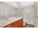 Bathroom with dual sinks, vanity, toilet, and shower/tub combo at 7469 Hunters Greene Cir, Lakeland, FL 33810