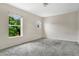 Bright bedroom with two windows and neutral carpeting at 7469 Hunters Greene Cir, Lakeland, FL 33810