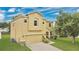 Attractive two-story home showcasing a well-kept lawn and a two car garage at 7469 Hunters Greene Cir, Lakeland, FL 33810