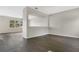 Spacious living room featuring laminate flooring, neutral walls, and lots of natural light at 7469 Hunters Greene Cir, Lakeland, FL 33810