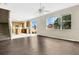 Open-concept living room with tile flooring, laminate flooring, staircase, and lots of natural light at 7469 Hunters Greene Cir, Lakeland, FL 33810