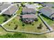 Aerial view of the property with a fenced-in yard and screened in patio at 816 Carmillion Ct, Groveland, FL 34736