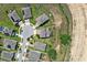 Aerial view of a residential neighborhood featuring well-manicured lawns and neatly arranged houses at 816 Carmillion Ct, Groveland, FL 34736