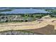 An aerial view showing community near the lake and future construction site at 816 Carmillion Ct, Groveland, FL 34736