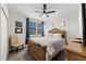 Comfortable bedroom featuring a ceiling fan, cozy chair, and elegant, wood-trimmed furniture set at 816 Carmillion Ct, Groveland, FL 34736