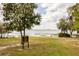 Lake view with a sign about Cherry Lake Park, showcasing the beauty and community information at 816 Carmillion Ct, Groveland, FL 34736