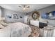 Stylish primary bedroom with decorative accents, a ceiling fan, and plush furnishings at 816 Carmillion Ct, Groveland, FL 34736
