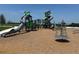 Community playground with climbing structures, slides, and a soft landing surface at 816 Carmillion Ct, Groveland, FL 34736