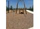 Wood and metal playground swing with nearby slides and woodchip ground cover at 816 Carmillion Ct, Groveland, FL 34736