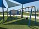 Playground area with swings and green turf at 816 Carmillion Ct, Groveland, FL 34736