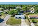 Aerial view of a cozy neighborhood and well-maintained property, surrounded by mature trees at 911 Ursula St, Ocoee, FL 34761