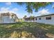 Large backyard featuring a utility shed, patio, and ample space for outdoor activities and recreation at 911 Ursula St, Ocoee, FL 34761