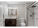 Modern bathroom with updated fixtures, tiled walls, and a glass-enclosed shower at 911 Ursula St, Ocoee, FL 34761