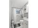 Updated bathroom featuring a sleek shower with tile surround, modern fixtures, and ample storage at 911 Ursula St, Ocoee, FL 34761