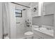 Updated bathroom featuring a sleek shower with tile surround, modern fixtures, and ample storage at 911 Ursula St, Ocoee, FL 34761