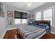 Bright bedroom features hardwood floors, neutral walls, and stylish decor at 1012 W New Hampshire St, Orlando, FL 32804