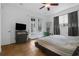 Bright bedroom with tile floors, a ceiling fan, and double doors leading to an outdoor space at 1012 W New Hampshire St, Orlando, FL 32804