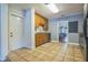 Traditional kitchen with wooden cabinets, granite countertops, and door access at 1012 W New Hampshire St, Orlando, FL 32804