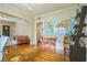 This living area has hardwood floors, lots of light, and an arched opening into the next room at 1012 W New Hampshire St, Orlando, FL 32804