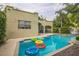 Relaxing backyard featuring a private pool with colorful floaties and ample patio space at 1012 W New Hampshire St, Orlando, FL 32804
