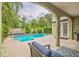 Inviting backyard pool area with chaise lounges and lush landscaping, perfect for relaxation at 1012 W New Hampshire St, Orlando, FL 32804