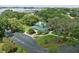 Stunning aerial view of a beautiful home with lush landscaping and a scenic view at 10146 Pointview Ct, Orlando, FL 32836