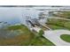 Expansive lakefront property with a private dock and boat lift, offering serene waterfront living and recreational opportunities at 10146 Pointview Ct, Orlando, FL 32836
