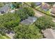 Aerial view of home featuring a pool surrounded by lush greenery and neighborhood at 10146 Pointview Ct, Orlando, FL 32836