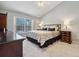 Bright, comfortable bedroom with large windows and a neutral color scheme at 10146 Pointview Ct, Orlando, FL 32836