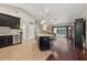 Bright kitchen features island with seating, stainless appliances, and an open layout to the living space at 10146 Pointview Ct, Orlando, FL 32836