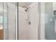 Close-up of the shower with white tiles and a modern shower head at 10146 Pointview Ct, Orlando, FL 32836