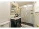 Updated bathroom features a stand-up shower, vanity sink, and modern fixtures at 11 S University Cir, Deland, FL 32724