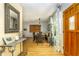 Inviting dining area featuring hardwood floors, an elegant light fixture, and ample natural light at 11 S University Cir, Deland, FL 32724