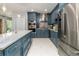 Bright and spacious kitchen with a large island, stainless steel appliances, and contemporary lighting at 11 S University Cir, Deland, FL 32724