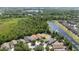 Aerial view showcasing the property's proximity to a serene lake and lush green spaces at 11218 Rouse Run Cir, Orlando, FL 32817