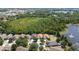 Aerial view of the property showcasing a peaceful neighborhood near a scenic lake at 11218 Rouse Run Cir, Orlando, FL 32817