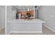 Stylish kitchen with a breakfast bar, stainless steel appliances, tiled backsplash, and quartz countertops at 11218 Rouse Run Cir, Orlando, FL 32817
