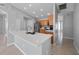 Bright kitchen features stainless steel appliances, a tile backsplash, and a large island with a sink at 11218 Rouse Run Cir, Orlando, FL 32817