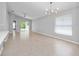 Bright living room with tile floors, a ceiling fan, and natural light streaming through the windows at 11218 Rouse Run Cir, Orlando, FL 32817