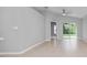Well-lit living room with a sliding glass door, neutral paint, tile flooring and ceiling fan at 11218 Rouse Run Cir, Orlando, FL 32817