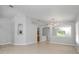 Bright, spacious living room features neutral colors, arched doorways, modern lighting and tile flooring at 11218 Rouse Run Cir, Orlando, FL 32817