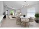 Bright living room showcasing open-concept layout, modern furniture and neutral color palette at 11218 Rouse Run Cir, Orlando, FL 32817