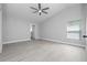 Large main bedroom features ceiling fan, natural light, ensuite bathroom, and light wood flooring at 11218 Rouse Run Cir, Orlando, FL 32817