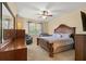 This spacious bedroom features a ceiling fan, and a large window for natural light at 11316 Rapallo Ln, Windermere, FL 34786