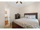 Relaxing bedroom with a bed, dresser, neutral colors, and carpet flooring at 11316 Rapallo Ln, Windermere, FL 34786
