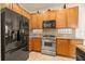 Well-equipped kitchen with stainless steel appliances, granite countertops, and light wood cabinetry at 11316 Rapallo Ln, Windermere, FL 34786